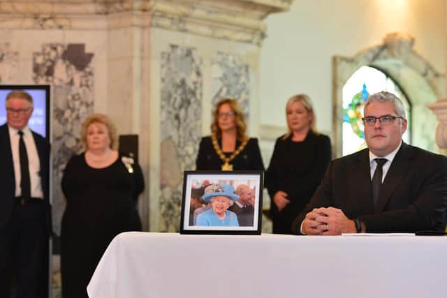 DUP MP Gavan Robinson sings the book of condolence