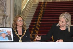 Sinn Fein Leader Michelle O'Neill (right) signs a Book of Condolence at Belfast City Hall, to mark the death of Queen Elizabeth II on Thursday. Photo: Mark Marlow/PA Wire