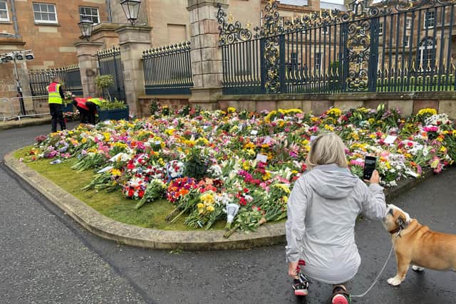 Floral tributes at Hillsborough Castle, Co Down following the death of Queen Elizabeth II on Thursday. Picture date: Monday September 12, 2022.