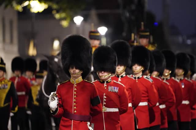 An early morning rehearsal for the procession of Queen Elizabeth's coffin from Buckingham Palace to Westmister Hall, London, where it will lie in state until her funeral on Monday