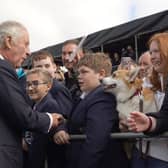 King Charles III meeting wellwishers as he arrives for a visit to Hillsborough Castle, Co Down, following the death Queen Elizabeth II on Thursday. Picture date: Tuesday September 13, 2022.