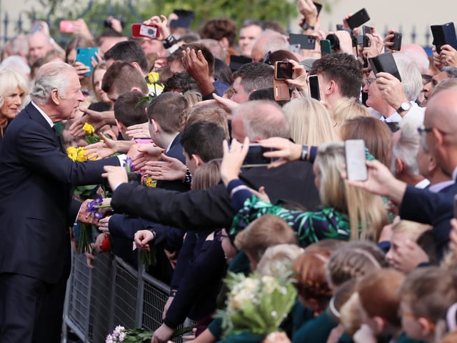 Crowds come out to welcome King Charles