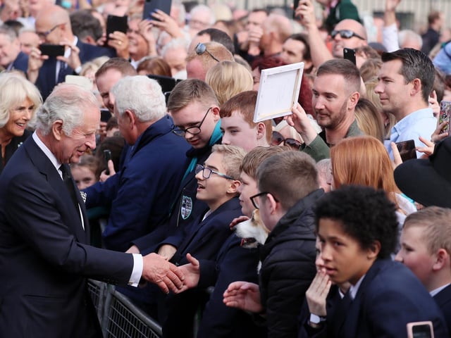 Crowds come out to welcome King Charles