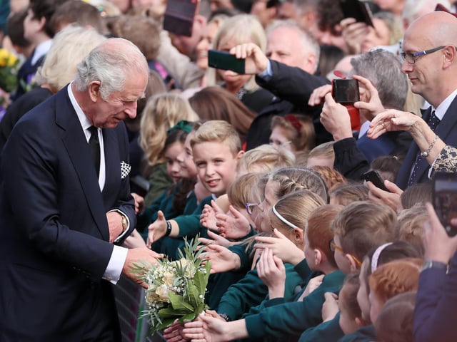 Crowds come out to welcome King Charles