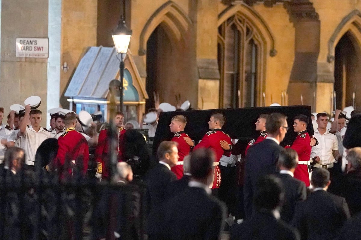 Royal guard collapses next to Queen's coffin on first night of lying in state