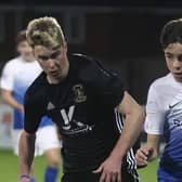 Thirteen-year-old Christopher Atherton (right) making history for Glenavon in the League Cup tie with Dollingstown. Pic by Pacemaker.