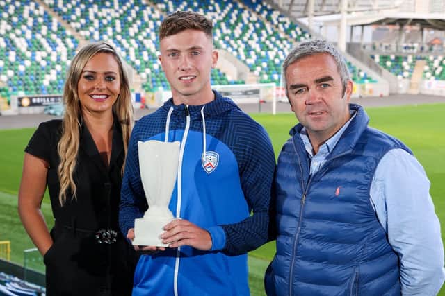 Coleraine's Matthew Shevlin (centre, Dream Spanish Homes Player of the Month for August) with NIFWA Chair Ruth Gorman and award sponsor Gerry Flynn (Dream Spanish Homes).
