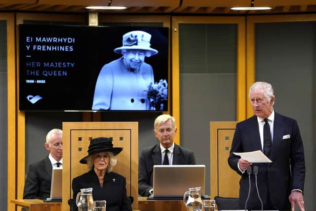 King Charles III, with the Queen Consort, speaking after receiving a Motion of Condolence at the Senedd in Cardiff, following the death of Queen Elizabeth II. Picture date: Friday September 16, 2022.