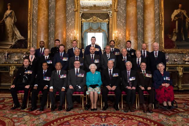 Members of the VC and GC Association attending a meeting with Queen Elizabeth II. Recipients of the Victoria Cross and George Cross have said they are "humble and honoured" to be involved in the procession at the Queen's funeral.