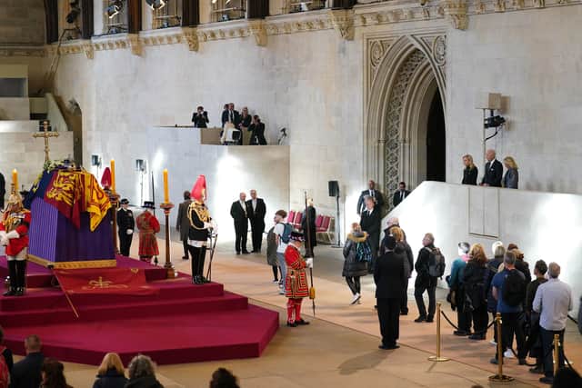 US President Joe Biden and First Lady Jill Biden (far right) view the coffin of Queen Elizabeth II, lying in state on the catafalque in Westminster Hall, at the Palace of Westminster, London. Picture date: Sunday September 18, 2022. PA Photo.
