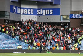 Dundee United fans in the stands after the final whistle of the Cinch Premiership match at Ibrox. Photo credit: Steve Welsh/PA Wire.