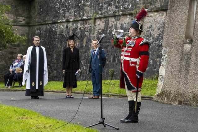 Rev Gamble and Lady Downshire look on at Sergeant Bugler Andrew Carlisle during a remembrance service for Queen Elizabeth II at Hillsborough Fort on Monday September 19
