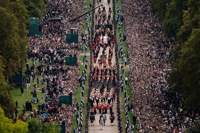 The Ceremonial Procession of the coffin of Queen Elizabeth II travels down the Long Walk as it arrives at Windsor Castle