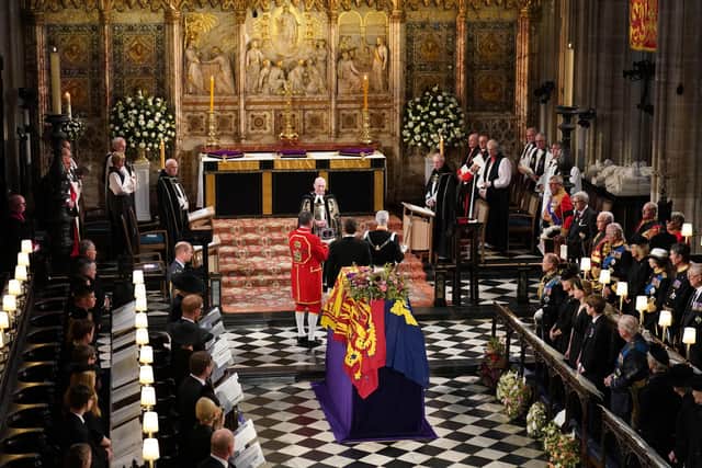 The Imperial State Crown is removed from the coffin of Queen Elizabeth II during the Committal Service at St George's Chapel in Windsor Castle, Berkshire