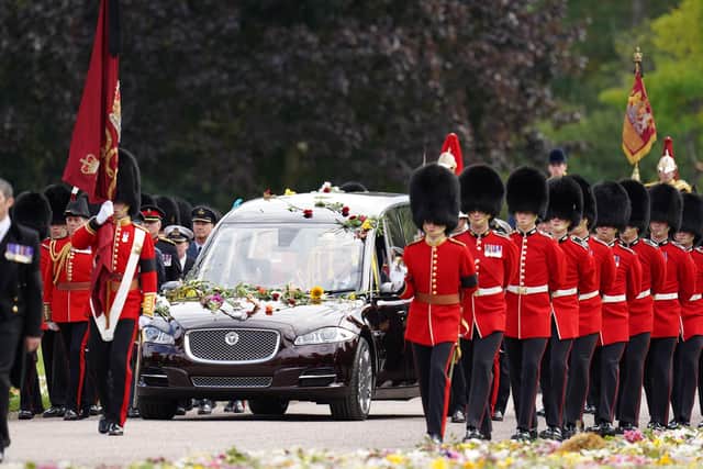 The Ceremonial Procession of the coffin of Queen Elizabeth II arrives at Windsor Castle