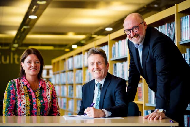 Moira Barratt, Fujitsu delivery executive, Jim O’Hagan, chief executive of Libraries NI and David Clements, client director Fujitsu NI are pictured signing a new contract worth £27million over a seven-year period to deliver modern and innovative IT services to Libraries NI