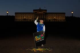 Charlie McCartan-Regan, 8, from Belfast, gets ready for the Glow Walk for Autism NI at Stormont Estate on November 12