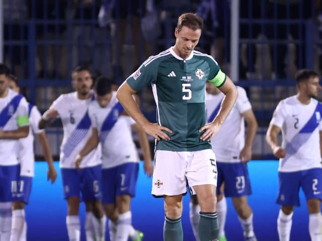 A dejected Jonny Evans during defeat to Greece on the night of his 100th Northern Ireland cap. Pic by PressEye Ltd.
