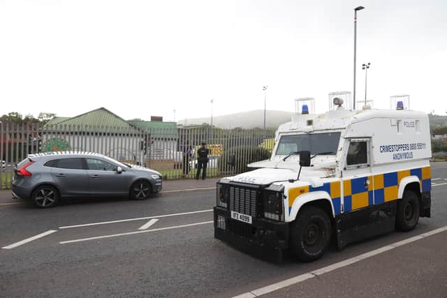 Officers from the PSNI and an armoured vehicle at the scene of a shooting at the clubhouse of Donegal Celtic Football Club, in west Belfast. Photo: Liam McBurney/PA Wire