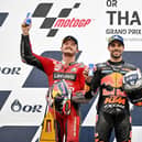 Thailand MotoGP race winner Miguel Oliveira on the rostrum with runner-up Jack Miller (left) and Pecco Bagnaia.