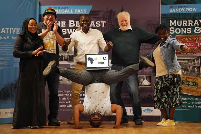 From left, Fatma Omar, Aidan Milligan, Cuthbert Tura Arutura, acrobat Rahim Saphy, Stan Papenfus and Deborah Kahubire  at the launch of the African Arts Collective in Belfast on Saturday