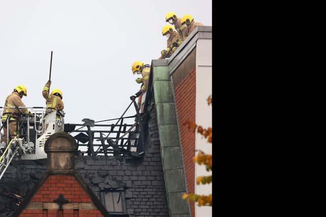 Firefighters at the scene of a blaze at a historic building in Belfast's Cathedral Quarter, where more than 50 personnel have been involved in the operation at Old Cathedral Building on Donegall Street since the early hour of the morning. Picture date: Monday October 3, 2022.