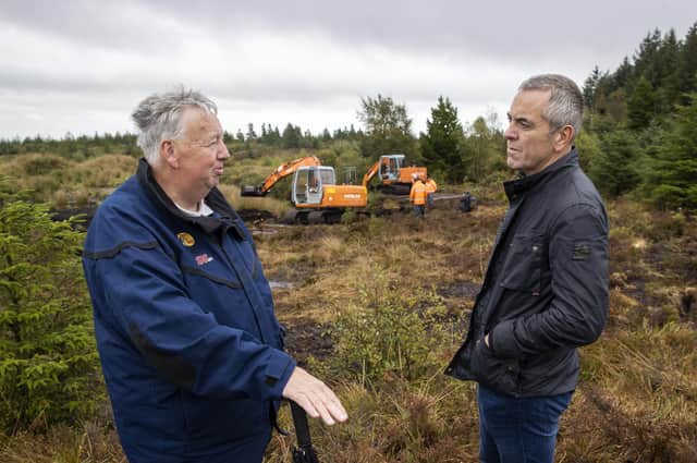 Oliver McVeigh, brother of Columba McVeigh with Jimmy Nesbitt at the search site at Bragan Bog, near Emyvale in Co Monaghan