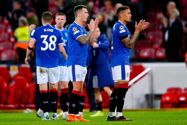 Rangers' James Tavernier (right) applauds the fans at the end of the UEFA Champions League, Group A match at Anfield