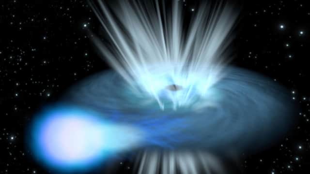 Photo issued by Queen's University Belfast of an artists impression of a black hole destroying a nearby star. A rare and dazzling cosmic explosion, which outshines most supernovae in the universe, has been spotted by researchers at Queen's University, Belfast. Photo: ESA/C.Carreau/PA Wire
