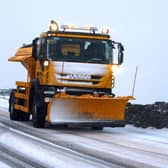 A gritter and snow plough. Peter Byrne/PA Wire