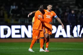 Rangers' Djeidi Gassama (left) celebrates scoring their side's third goal of the game with team-mate James Tavernier during the William Hill Premiership match at Dens Park, Dundee