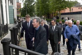 Breandan Mac Cionnaith (Brendan McKenna) (second left) of the Garvaghy Road Residents' Coalition arrives with others at Laganside Courts in Belfast