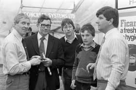 William McKillen of Tullymar Agency discussing veterinary equipment at the pig fair in September 1982, with Jim Grant, Aghalee, and his sons, Thomas and Nigel. On the right John Neillis of Fisons. Picture: News Letter archives