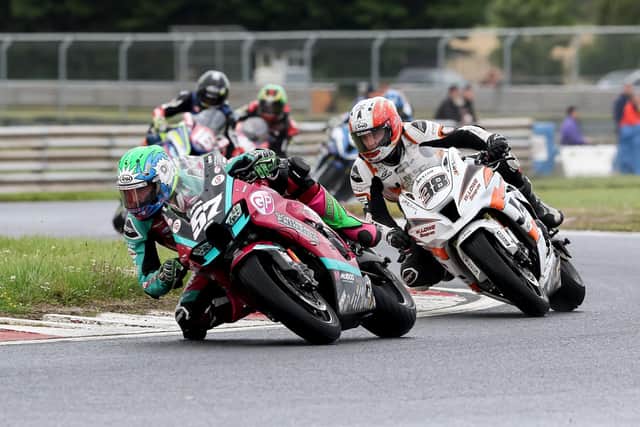 Korie McGreevy (McAdoo Kawasaki) leads Jason Lynn (J McC Roofing Kawasaki) in the opening Superbike race at the Neil and Donny Robinson Memorial meeting at Bishopscourt on Saturday. Picture: Derek Wilson/Pacemaker Press