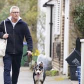 Match Of The Day host Gary Lineker returns to his home in London with his dog.