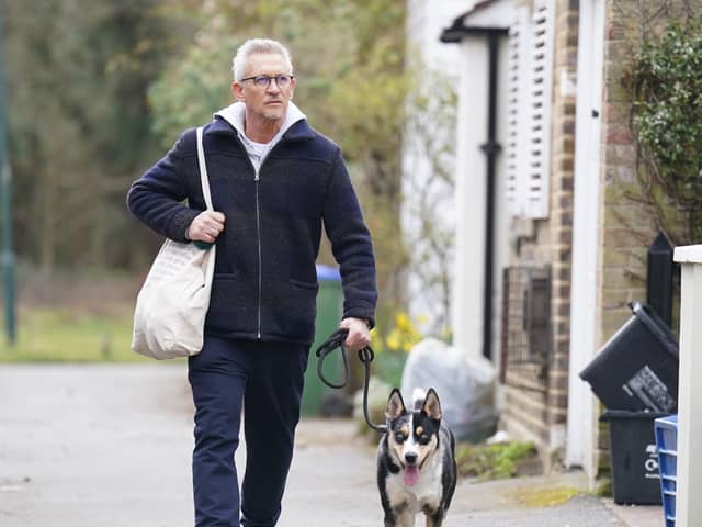 Match Of The Day host Gary Lineker returns to his home in London with his dog.