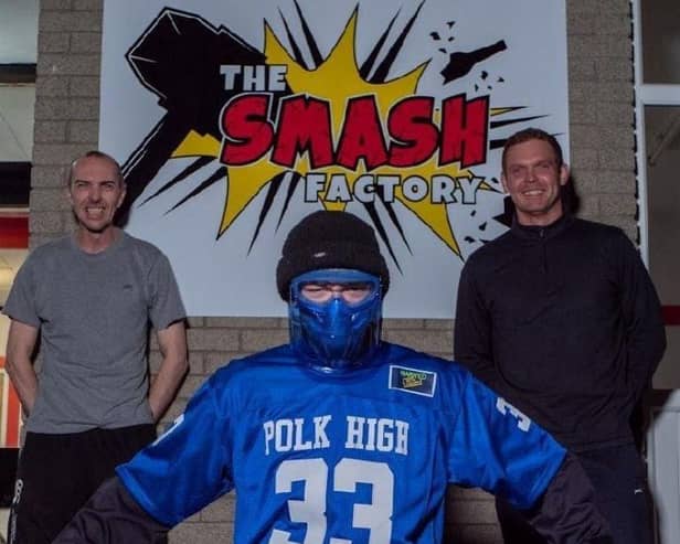 Best friends Gary Anderson and Marc Logan from Coleraine have opened The Smash Factory, a new entertainment hotspot – only the second of its kind in Northern Ireland. They are pictured with Grand Master Smash