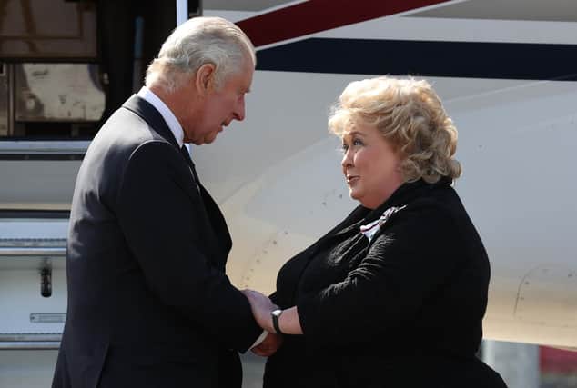 Lord Lieutenant of Belfast Dame Fionnuala Jay-O'Boyle greets King Charles III as he arrives at Belfast City Airport in Northern Ireland