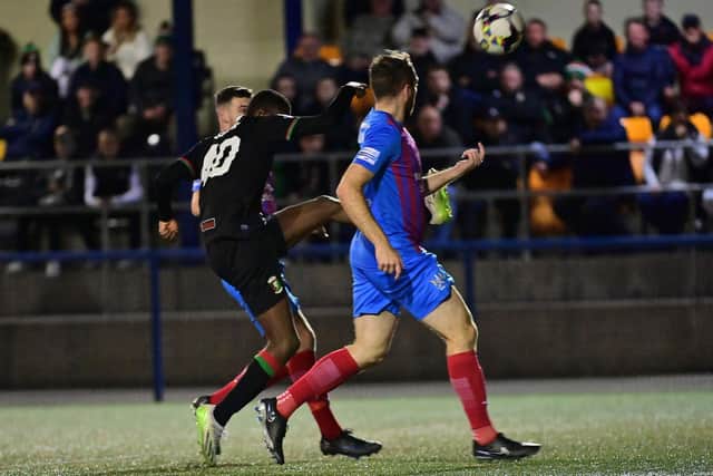 Glentoran’s Junior breaks the deadlock with a measured lob against Ards in the Co Antrim Shield quarter-finals. (Photo by Colm Lenaghan/Pacemaker)