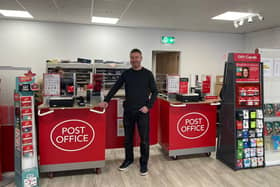 Downpatrick Post Office has opened at a new location to restore vital Christmas services after Storm Babet. Pictured is Gareth Latus inside the temporary shop at Unit 5a Grove Shopping Centre, Downpatrick