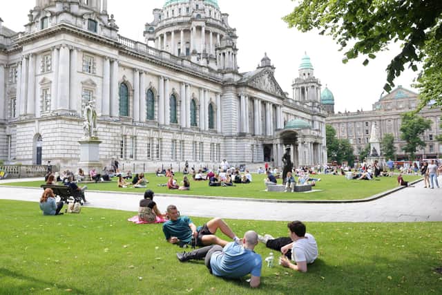 People enjoying the good weather at Belfast City Hall on June 23; it turns out that June 2026 was among the warmest on record