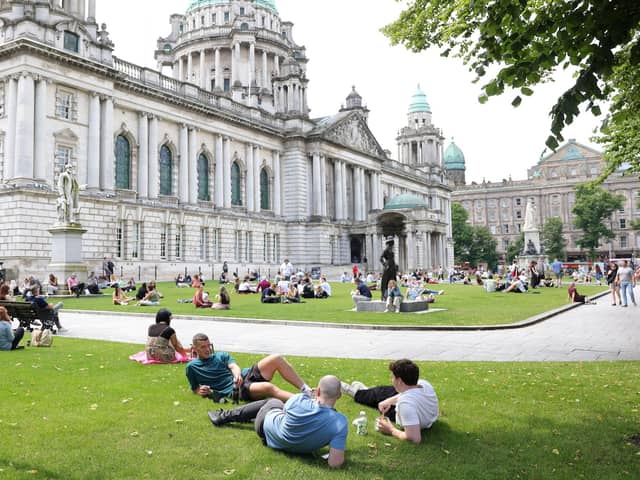 People enjoying the good weather at Belfast City Hall on June 23; it turns out that June 2026 was among the warmest on record