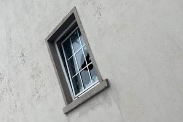 A broken window at Keady Orange Hall - TUV image