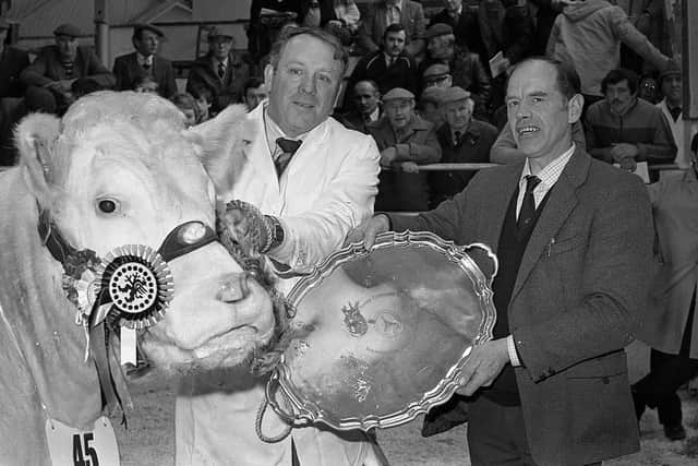 Pictured in March 1983 is Robert Simpson who is seen handing over the Allied Irish Banks salver to Leftus Lucy for the champion heifer at a Charolais show and sale which was held at the Automart, Portadown. Picture: News Letter archives/Darryl Armitage