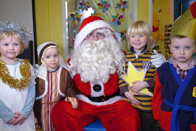 Pupils from Moneymore Nursery  Unit pose for the camera with Santa Claus during his flying visit to the unit last Thursday morning.mm52-326sr
