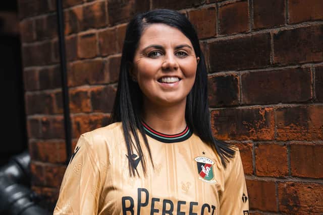 Glentoran Women's captain Jess Foy models 'The Gold Standard' away kit. (Photo by Glentoran FC)