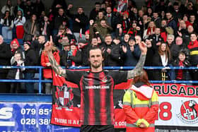 Declan Caddell takes the deserved plaudits from Crusaders fans at Mourneview Park