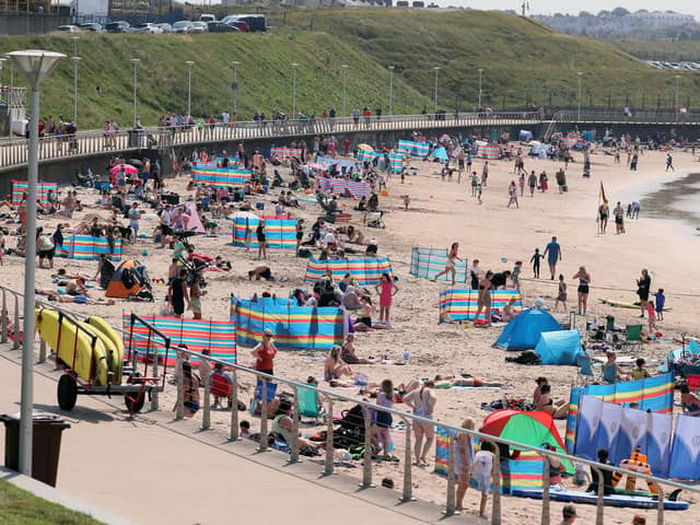 Crowds in Portrush enjoying the hottest day of the year in Northern Ireland on July 18. Photo by Jonathan Porter / Press Eye