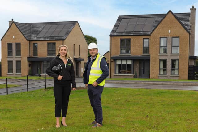 Belfast's Encom Energy  has secured three major contracts to provide Solar Photovoltaic (PV) & Battery Storage solutions for over 1,400 homes in Northern Ireland, worth approximately £10-£12 million.  Pictured are Anna Patterson, Encom Energy with Alan Johnston, development director at Mayfair