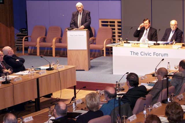 Seamus Mallon Deputy First Minister speaking to the members of the 60-strong Civic Forum, which held their first meeting at the Waterfront Hall in Belfast, in October 2000